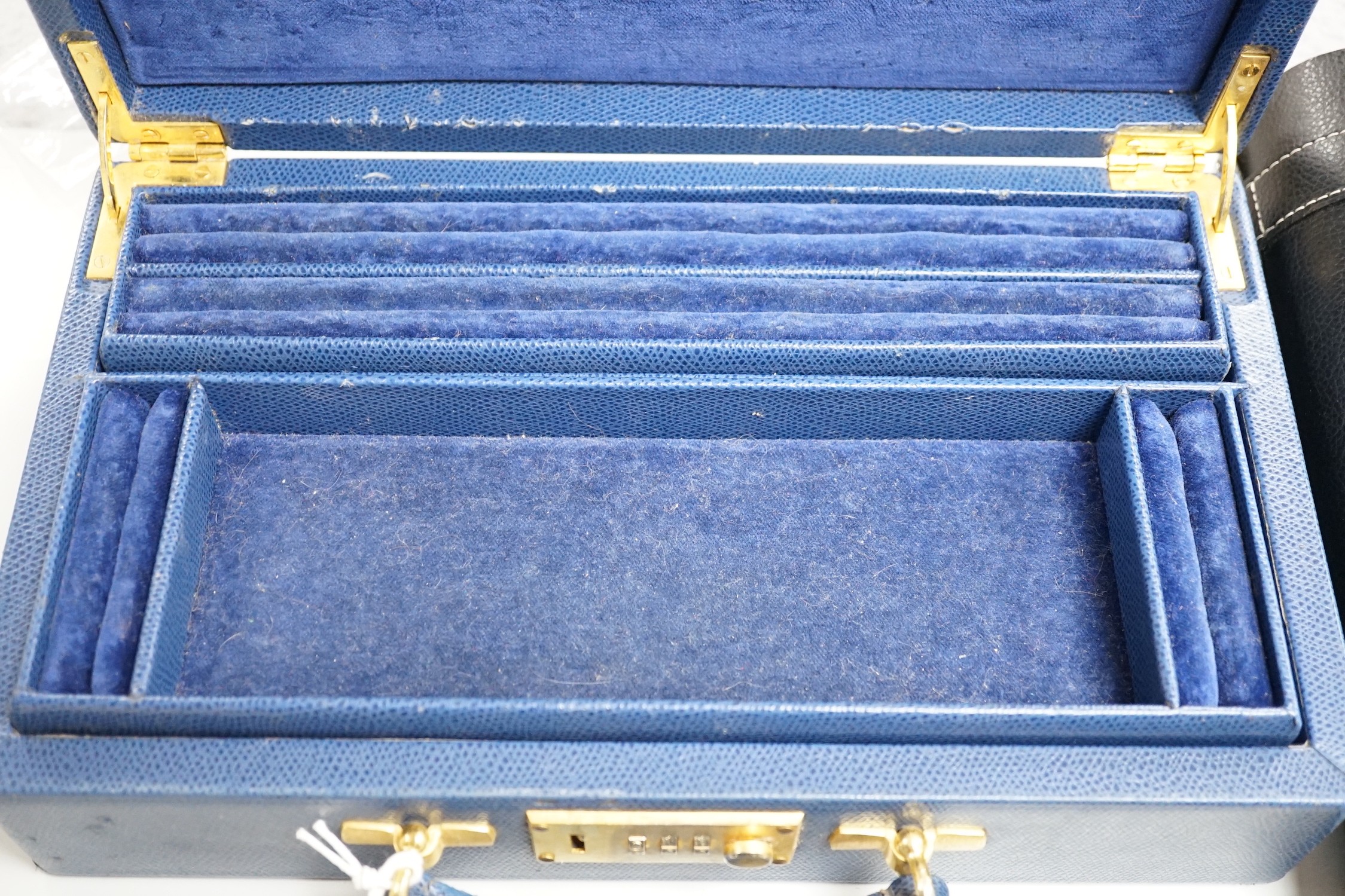 A cased novelty cocktail set and a Fortnum & Mason fitted leather case - combination lock 0000, 31cms wide x 18cms deep